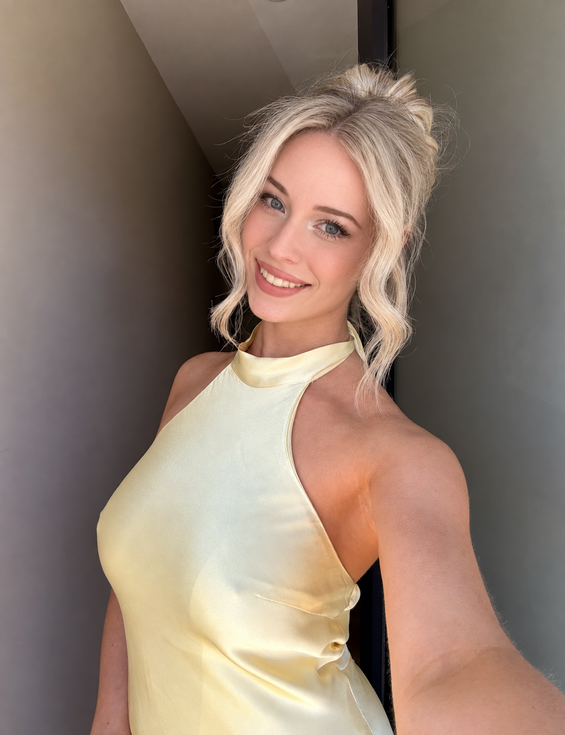 Arabella in a pale-yellow halter outfit